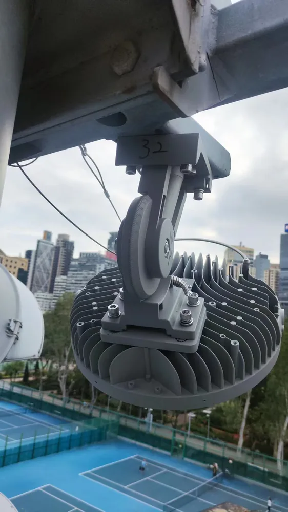 600 W Scorpius mounted on original cross-arm above a tennis court