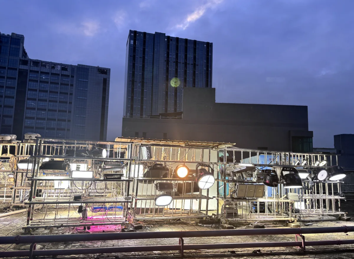 Rooftop aging rack at night, fixtures lit