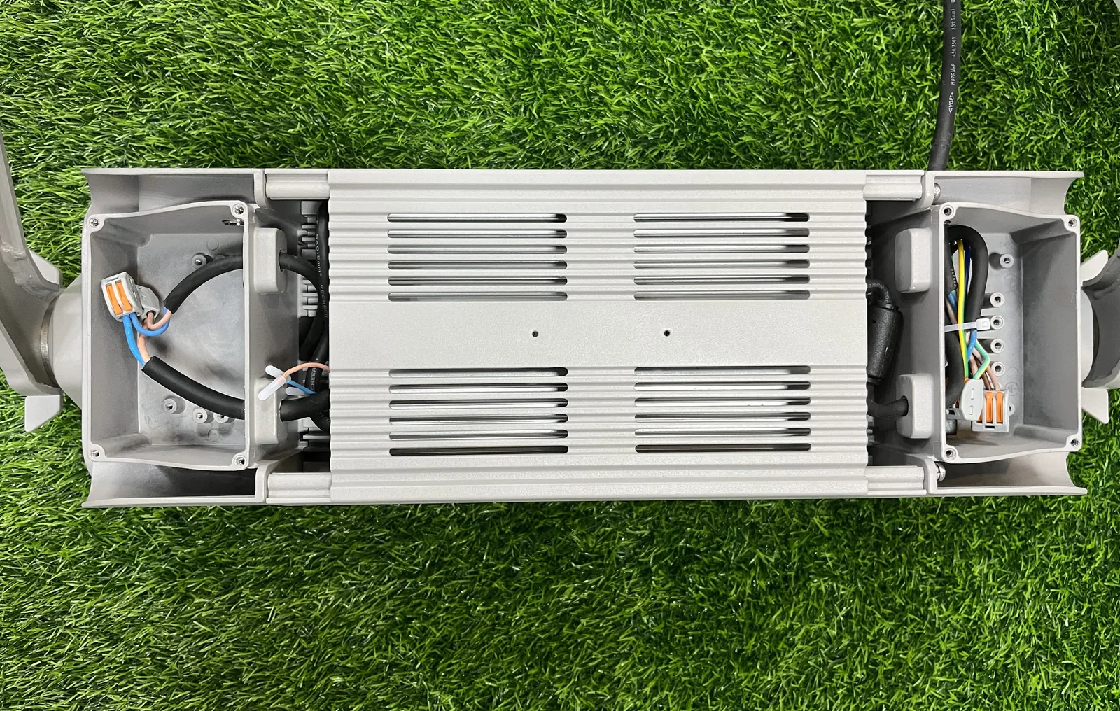 Electrical cavity opened, showing driver and separated AC and DC compartments